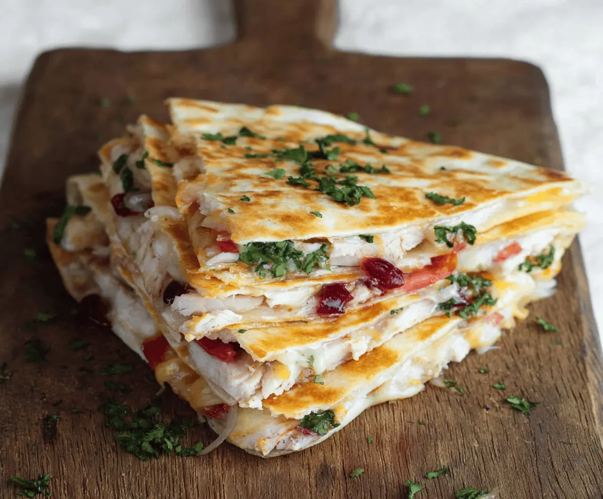 Delicious turkey quesadilla fresh from the pan, filled with melted cheese and grilled turkey slices.