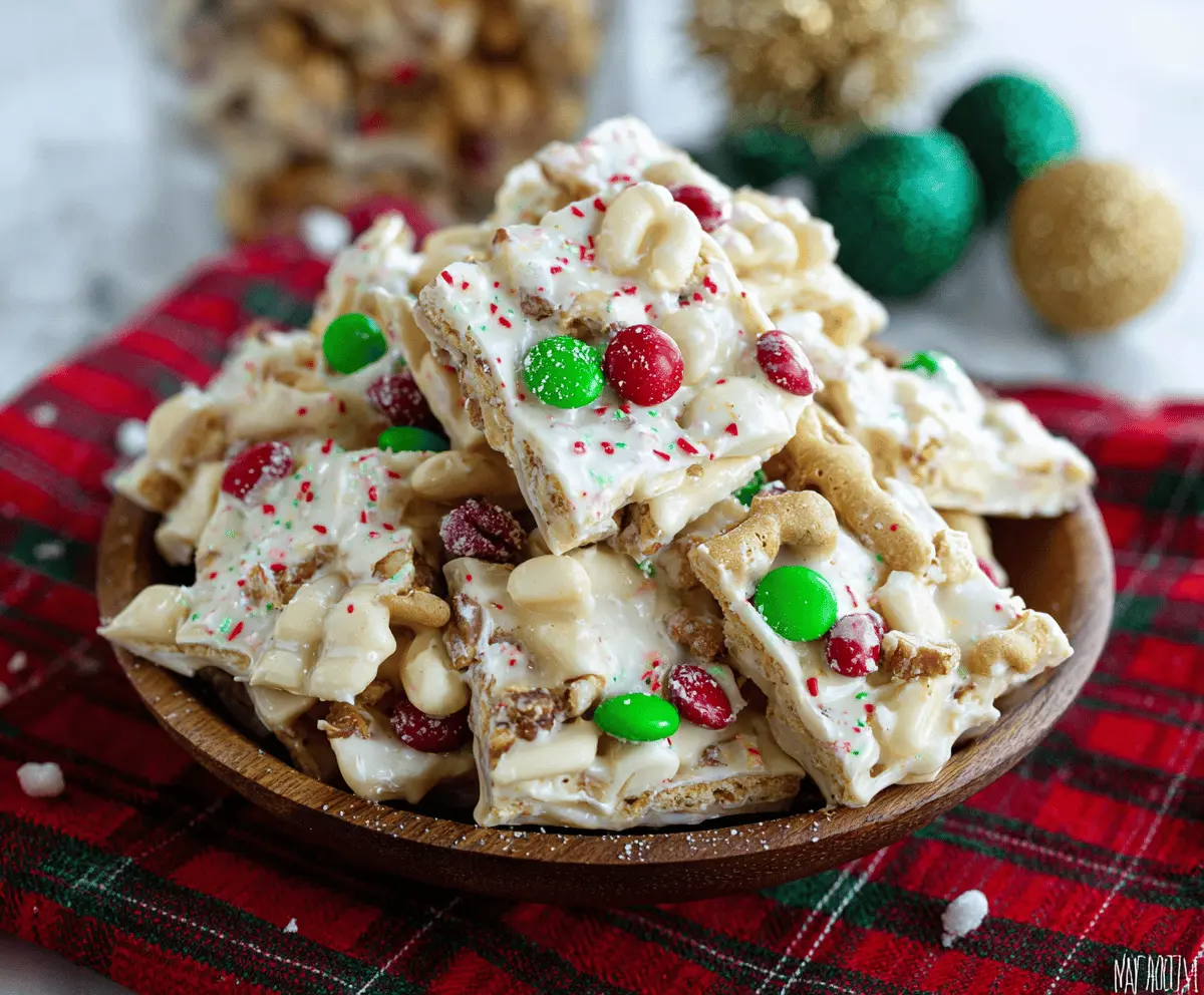 Delicious White Chocolate Christmas Crack decorated with festive toppings on a holiday platter.