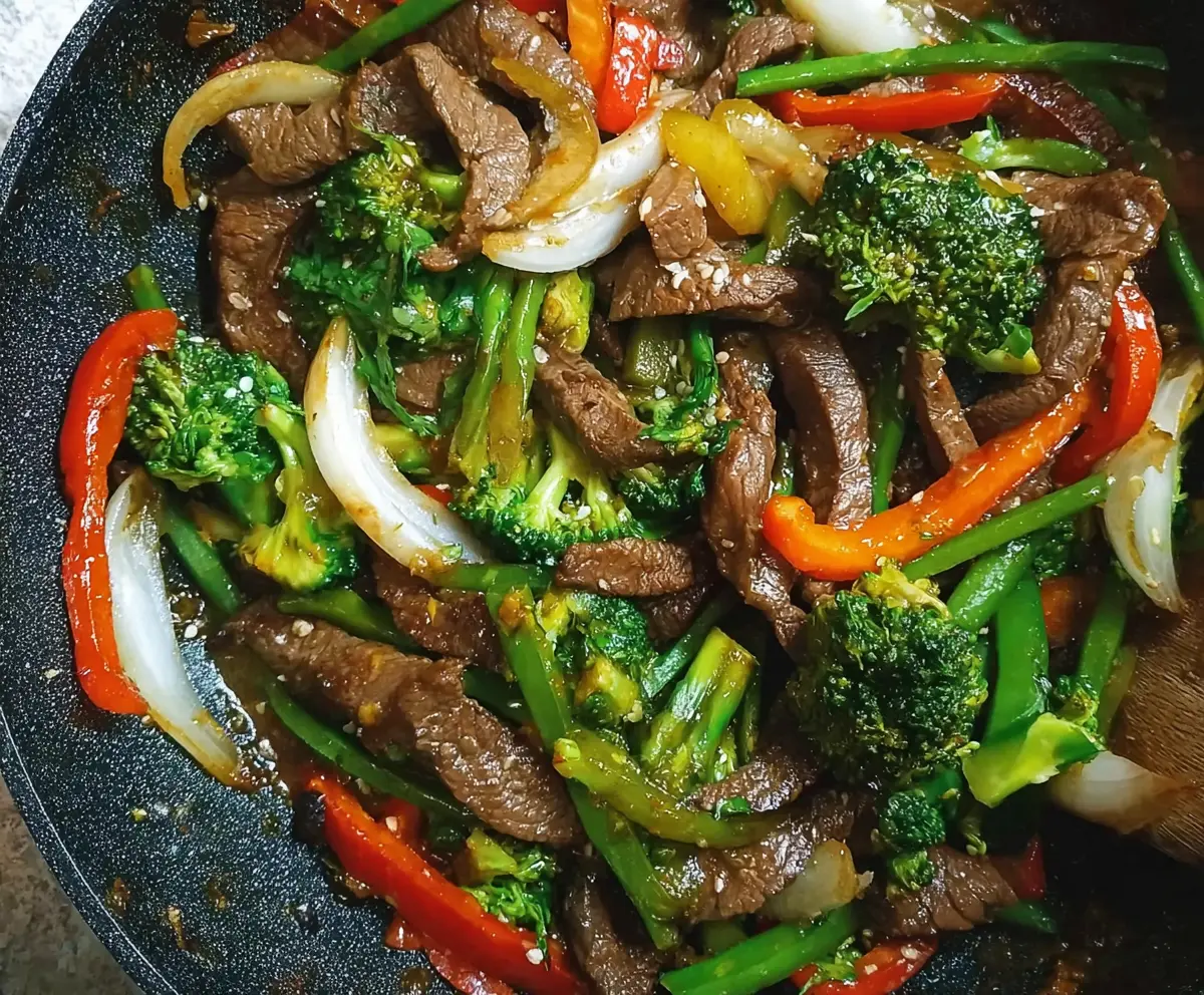 Delicious easy beef stir fry with colorful vegetables and tender beef slices in a savory sauce.