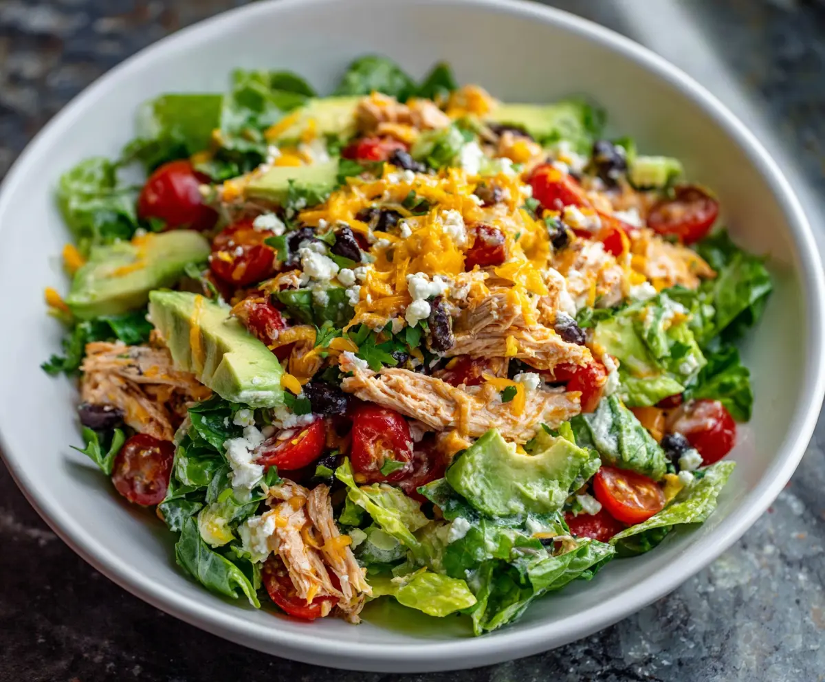 Colorful Taco Chicken Salad with fresh vegetables and seasoned chicken in a bowl