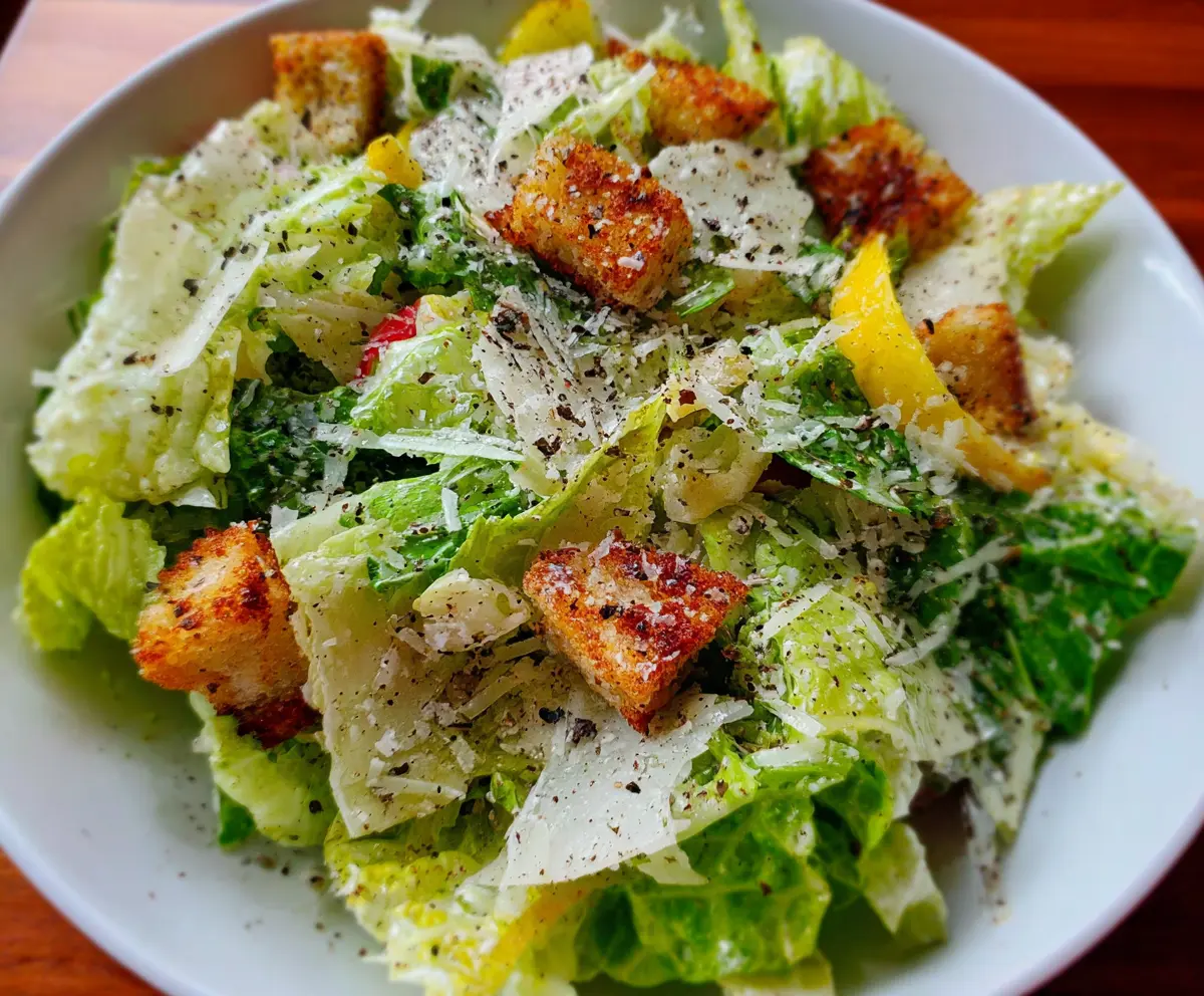 Fresh Nana's Crunchy Lemon Parmesan Salad with zesty lemon dressing and grated Parmesan cheese.